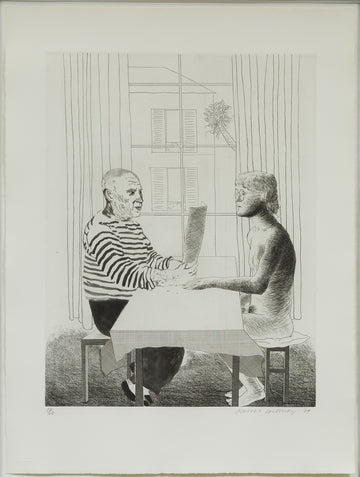A cropped view of an etching by David Hockney, the artwork shows an artist and model seated across from each other at a table inside a private setting. The artist is wearing a striped shirt and dark pants and is holding a piece of paper in front of him. The model is a male figure with glasses, and is naked and sitting on a cushioned seat. 